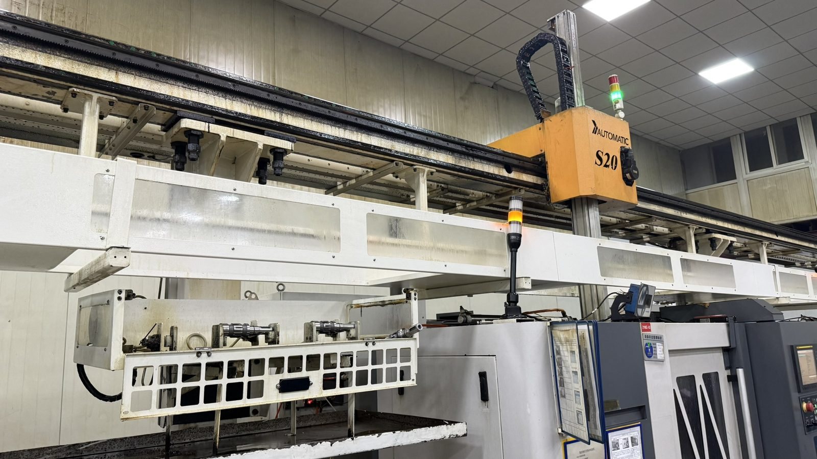 Gantry loader automating CNC machining of motor parts